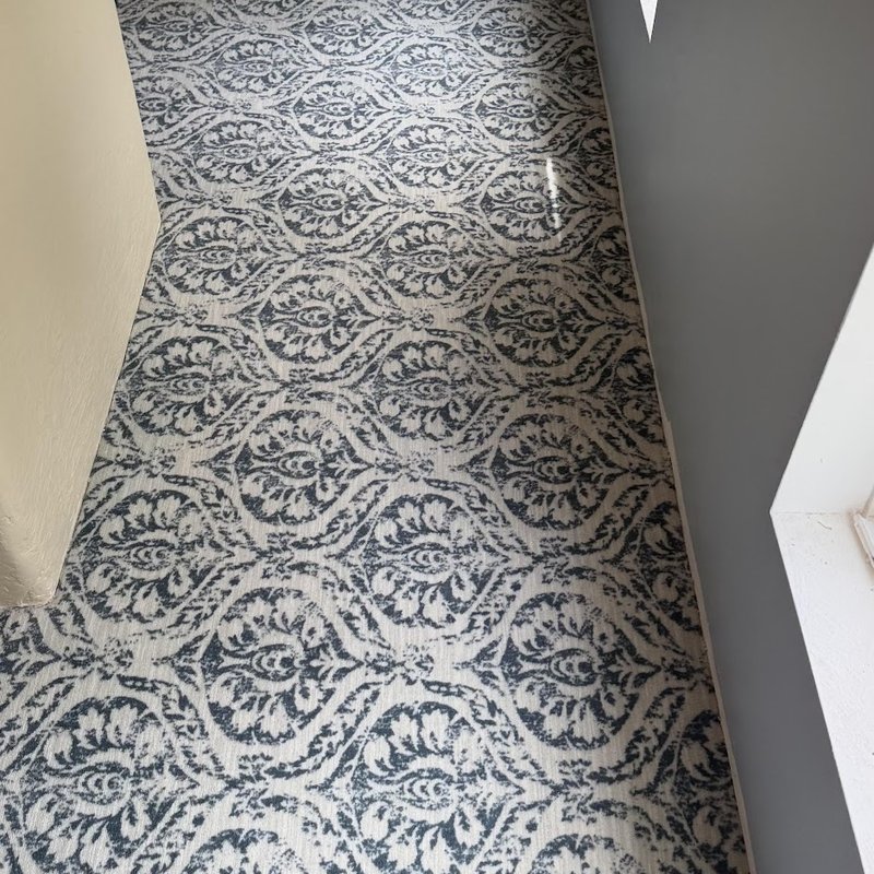 The same damask pattern carried into the hallway
